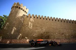 Max Verstappen driving the Red Bull RB20 past Baku’s historic city walls during the Azerbaijan Grand Prix 2025